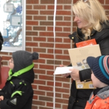 Parents and children visit the library